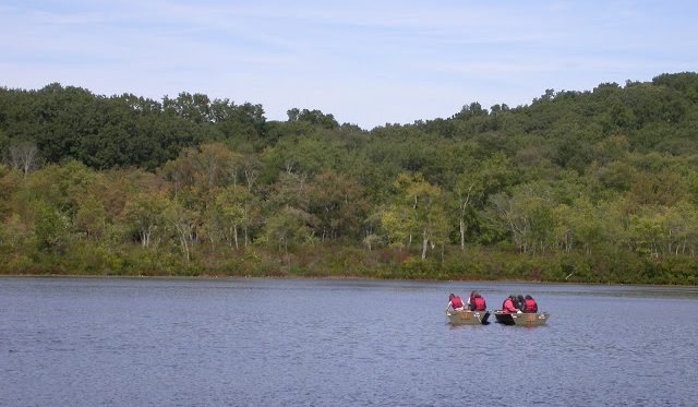 Students studying the ecology of lakes, streams and wetlands