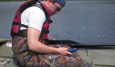 Students studying the ecology of lakes, streams and wetlands